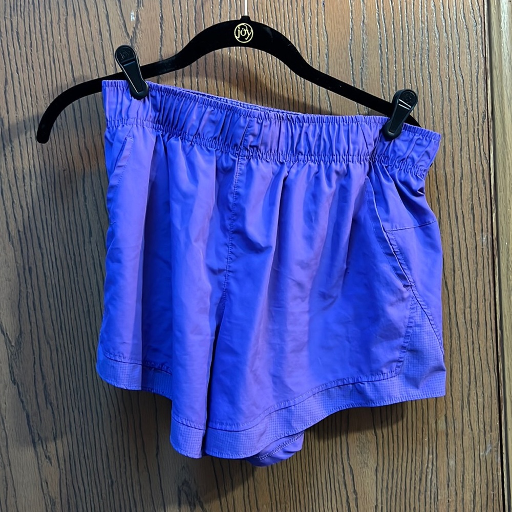 Purple athletic running shorts with built in liner